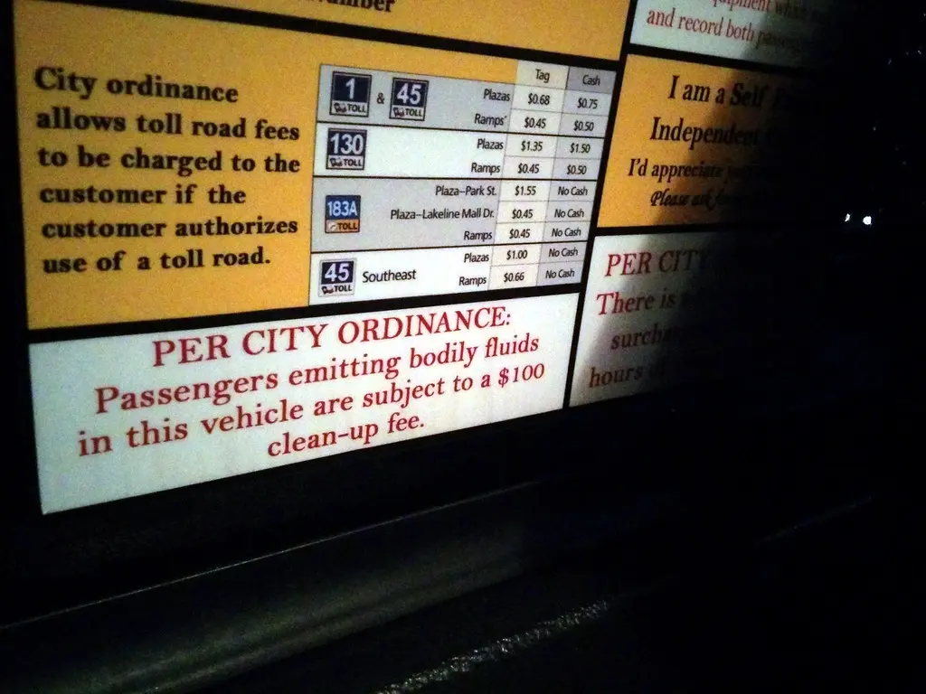 Ejecting bodily fluids warning, taxi, SXSW, Austin, TX, USA