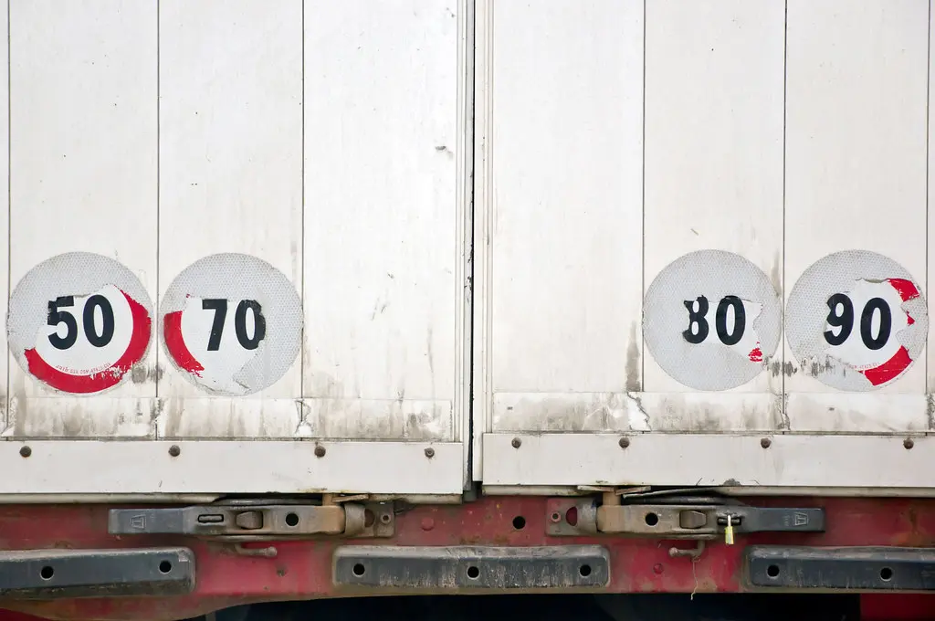 Back of a white lorry with old stickers