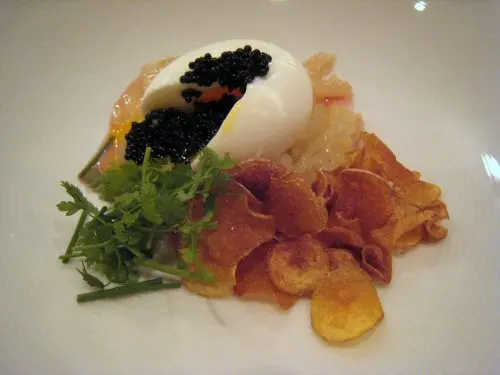 momofuku ko coddled egg with paddlefish caviar, onion soubise, potato chips and chervil